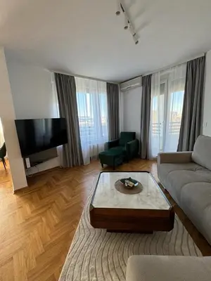 a living room with a couch and a coffee table at Arena Mila in Novi Beograd