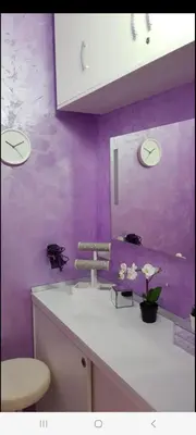 a purple bathroom with a sink and a mirror at Lux Apartments With Pool Dex in Zemun Polje