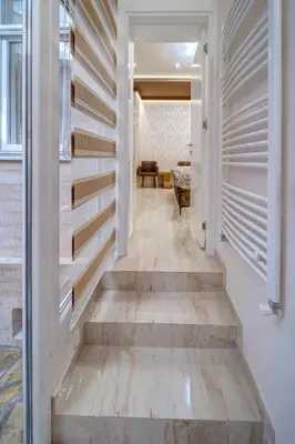 a hallway of a home with wooden stairs at Apartment Kaliopi in Belgrade