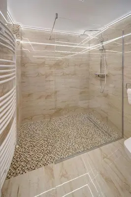 a shower with a glass door in a bathroom at Apartment Kaliopi in Belgrade