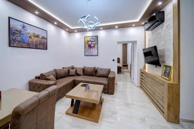 a living room with a couch and a table at Apartment Kaliopi in Belgrade