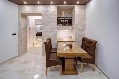 a dining room with a table and chairs at Apartment Kaliopi in Belgrade