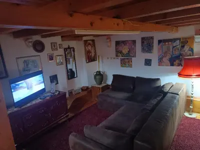 a living room with a couch and a flat screen tv at Maravilja 7 in Belgrade