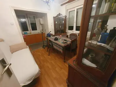 a room with a bed and a table in a room at Nikola Hram in Belgrade