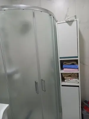 a shower stall with a mirror in a bathroom at Nikola Hram in Belgrade