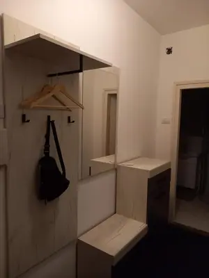 a room with a closet with shelves and a purse at Nikola Hram in Belgrade