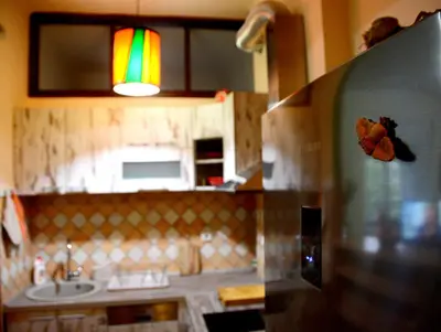 a kitchen with a refridgerator with a rainbow on it at Studio Tash in Belgrade