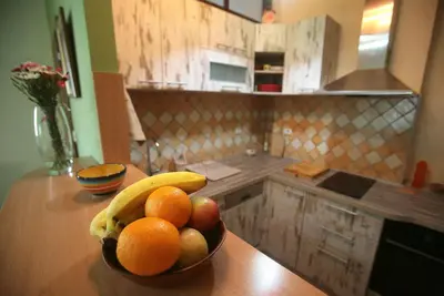a bowl of fruit on a counter in a kitchen at Studio Tash in Belgrade