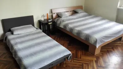 two beds sitting next to each other in a bedroom at Studio Tash in Belgrade