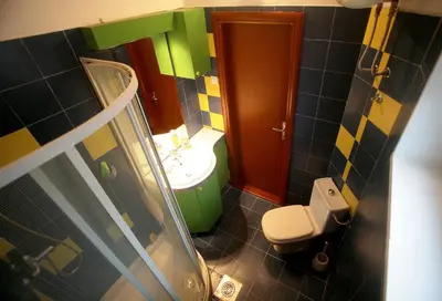 a small bathroom with a toilet and a sink at Studio Tash in Belgrade