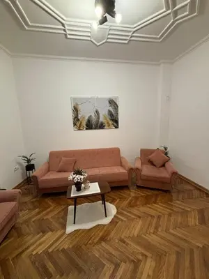 a living room with two couches and a table at Apartment Washington in Belgrade