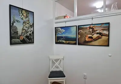 a group of four pictures hanging on a wall at Dali Arena Business Comfort Apartment 2 Bedrooms King Size in Belgrade