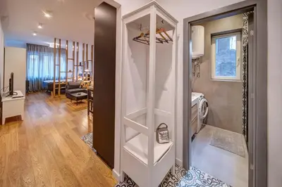 a room with a door leading to a living room at Miss Sunshine 4* in Belgrade