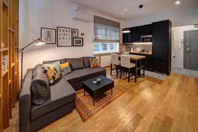 a living room with a couch and a table at Miss Sunshine 4* in Belgrade