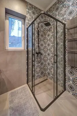 a shower with a glass door in a bathroom at Miss Sunshine 4* in Belgrade