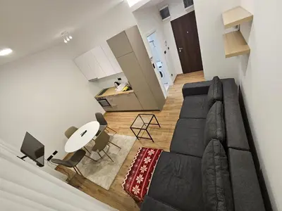 a living room with a couch and a table at Anchy in Belgrade