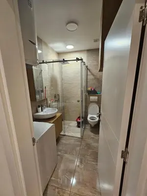 a bathroom with a shower and a sink and a toilet at Anchy in Belgrade
