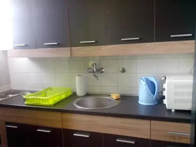 a kitchen counter top with a sink and a counter top at Apartment Baroque in Belgrade