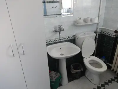 a small bathroom with a toilet and a sink at Apartment Baroque in Belgrade