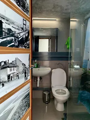 a bathroom with a toilet and a sink at Gallery in Belgrade