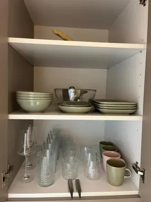 a shelf with plates and bowls and other dishes at My Pier in Bele Vode