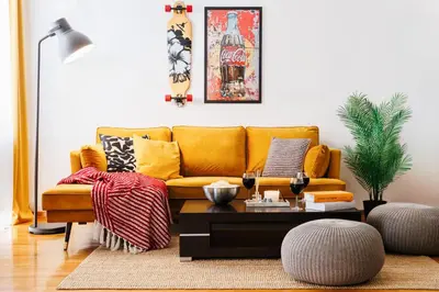 a living room with a yellow couch and a coffee table at Big Company 3min to Republic Square Renovated in Belgrade