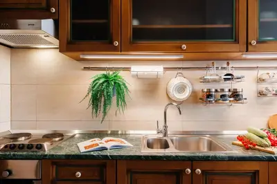 a kitchen with a sink and a counter top at Big Company 3min to Republic Square Renovated in Belgrade