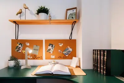 a desk with a book and a lamp and a shelf at Big Company 3min to Republic Square Renovated in Belgrade
