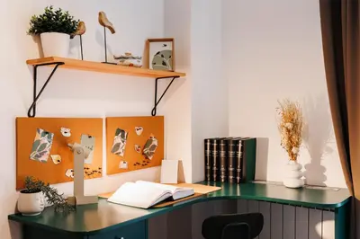 an office with a green desk with a book at Big Company 3min to Republic Square Renovated in Belgrade