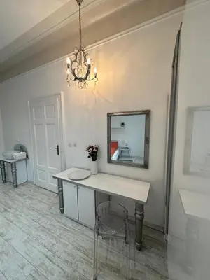 a dressing room with a table and a mirror at Sofi1 in Belgrade