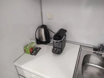 a kitchen counter top with a toaster and a microwave at Sofi 2 in Belgrade