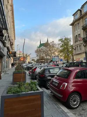 a bunch of cars parked on the side of a street at Sofi 2 in Belgrade