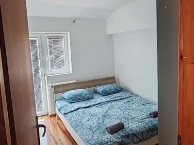 a bedroom with a bed and two pillows on it at Stan na dan BALANS in Ledine