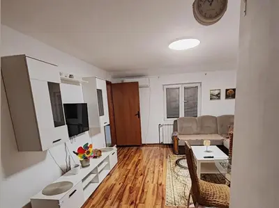 a living room with a couch and a table at Stan na dan BALANS in Ledine
