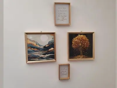 a wall with three pictures of a tree on it at Stan na dan BALANS in Ledine