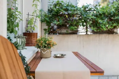 a table with a bowl on it on a patio at Studio apartment Duda in Karaburma