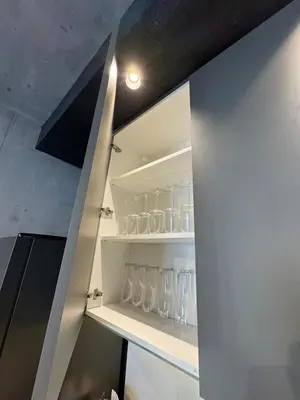 a shelf with glasses on it in a kitchen at Belgrade Waterfront Luxury Apartment in Belgrade