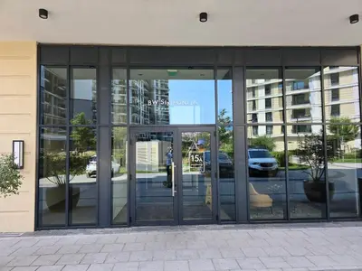 an entrance to a building with revolving glass doors at Belgrade Waterfront Luxury Apartment in Belgrade