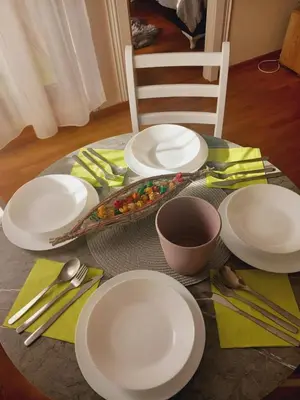 a table with white plates and silverware on it at LIBERO 78 in Vračar (historical)