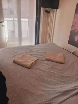 a bed with two brown pillows on top of it at LIBERO 78 in Vračar (historical)