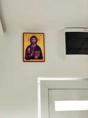 a picture of a man on a wall next to a door at Penthouse Palace in Belgrade