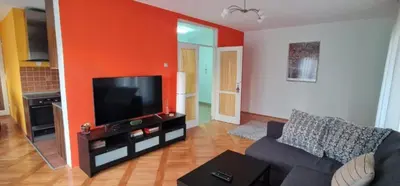 a living room with a couch and a flat screen tv at Best to rest B62 in Belgrade