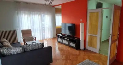 a living room with a couch and a flat screen tv at Best to rest B62 in Belgrade