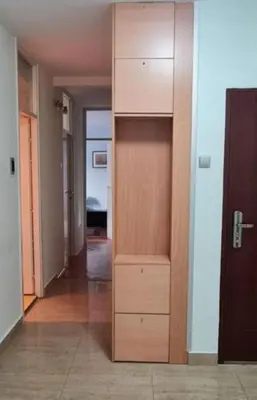 a tall wooden cabinet in a room with a hallway at Best to rest B62 in Belgrade