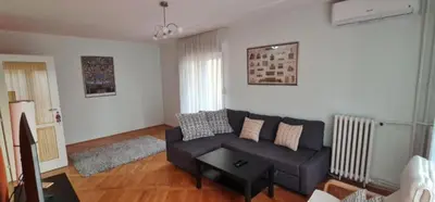 a living room with a couch and a table at Best to rest B62 in Belgrade