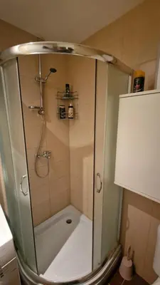 a shower with a glass door in a bathroom at Laki 15 in Kalugjerica