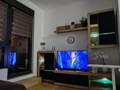 a living room with a flat screen tv at Viva apartment in condominium in Voždovac