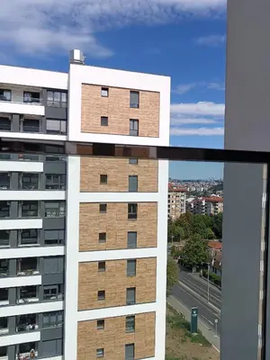 a view of a building from a balcony at Viva apartment in condominium in Voždovac