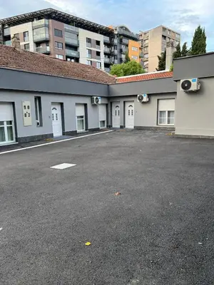 an empty parking lot in front of a building at Paradiso1 in Vračar (historical)