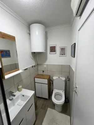 a bathroom with a white toilet and a sink at Paradiso1 in Vračar (historical)